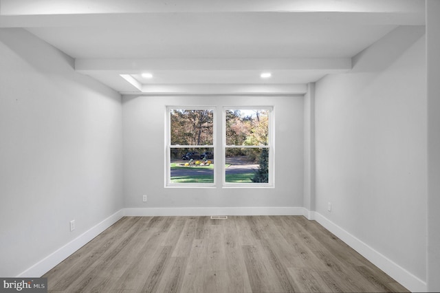 spare room with light hardwood / wood-style flooring