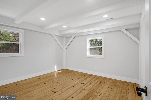 interior space featuring beam ceiling and hardwood / wood-style flooring