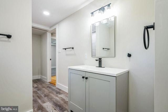 bathroom with vanity and hardwood / wood-style flooring