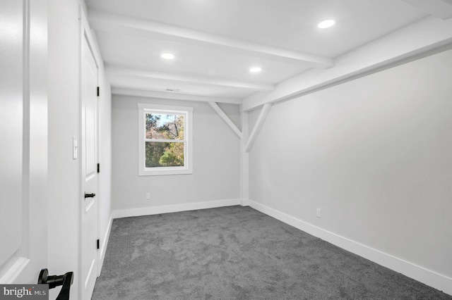 basement featuring dark colored carpet