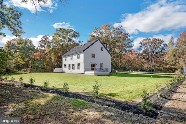 view of side of property with a yard