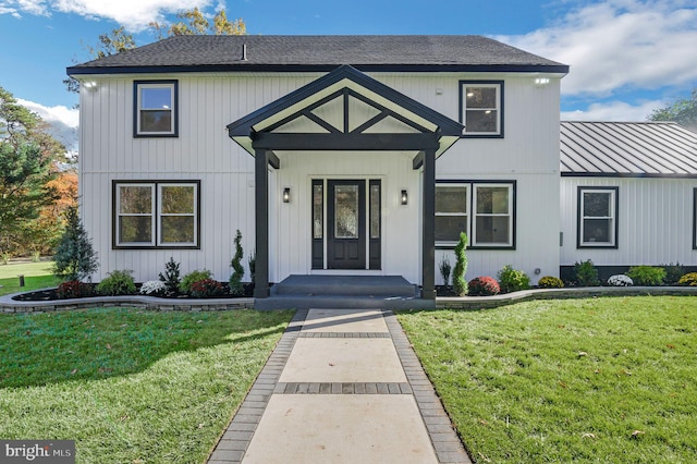 view of front of property with a front lawn