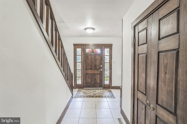 foyer entrance featuring light tile patterned floors