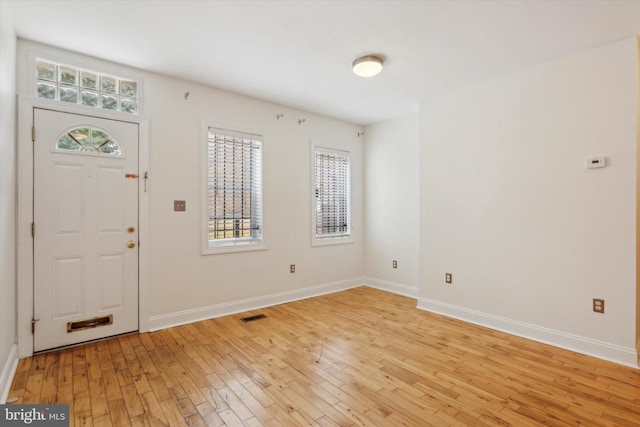 foyer with light hardwood / wood-style floors and plenty of natural light