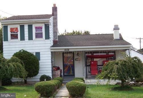 view of front of home featuring a chimney