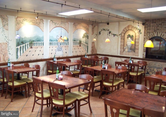 dining area featuring tile patterned flooring