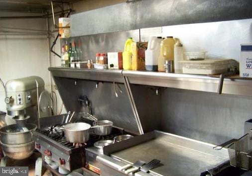 interior space featuring stainless steel range oven