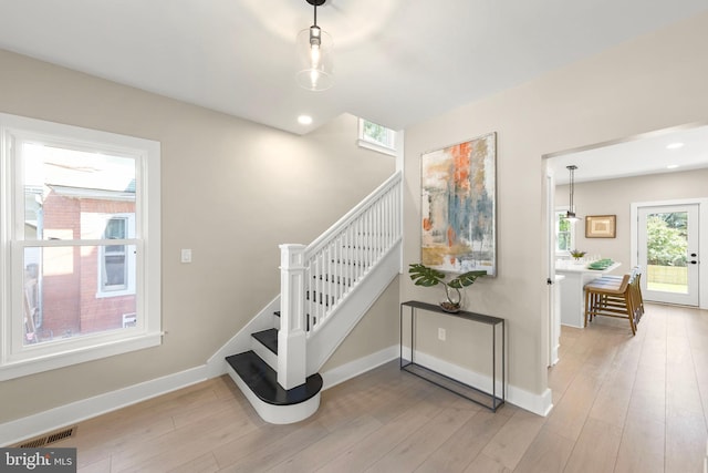 staircase featuring hardwood / wood-style flooring