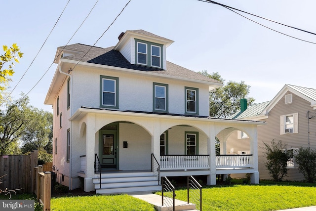 view of front of house with a front lawn and covered porch