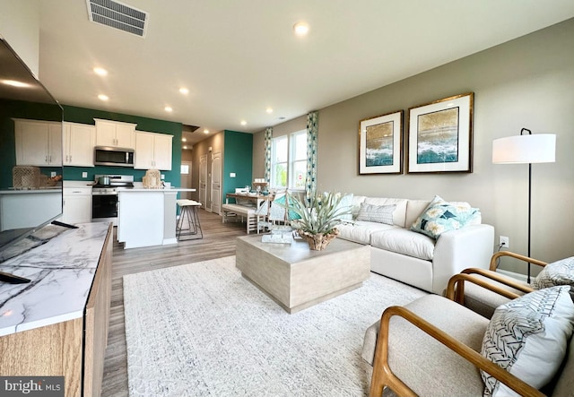 living room with light hardwood / wood-style floors