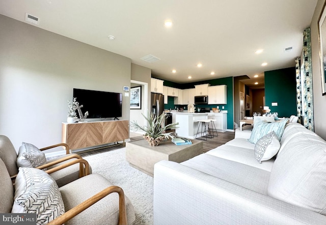 living room with wood-type flooring