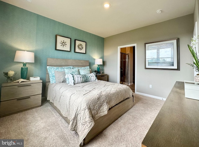 bedroom featuring light carpet