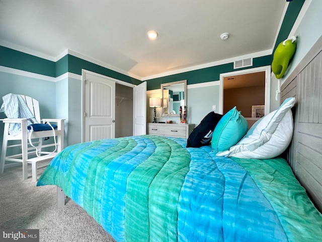 carpeted bedroom featuring a closet and ornamental molding