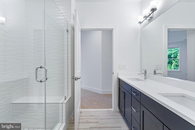 78 Old Mill Bottom Rd N Unit 112, Annapolis, MD 21409 - full bathroom featuring a shower stall, baseboards, a sink, and double vanity