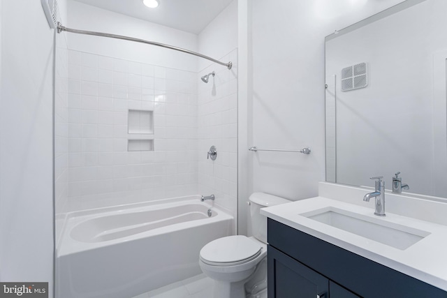 full bathroom featuring vanity, toilet, and tiled shower / bath combo