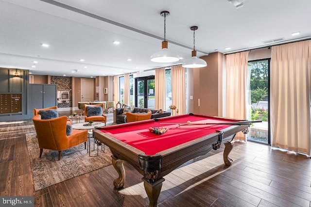 game room featuring dark wood-type flooring, plenty of natural light, and billiards