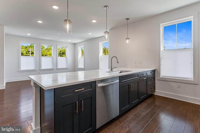 kitchen with pendant lighting, dishwasher, sink, and a wealth of natural light