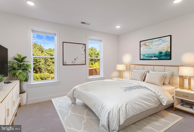 bedroom with light colored carpet