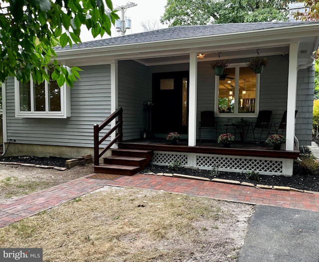 doorway to property featuring covered porch