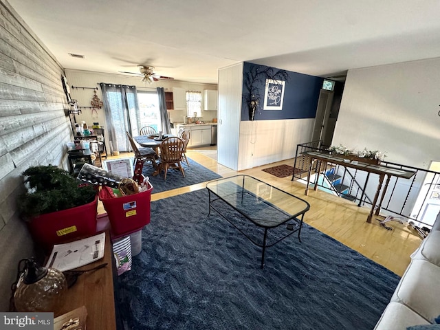 living room featuring hardwood / wood-style flooring and ceiling fan