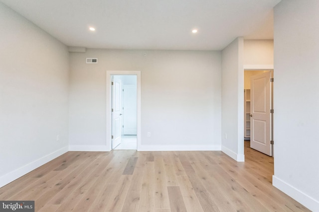 unfurnished room featuring light wood-type flooring