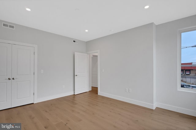 unfurnished bedroom with light hardwood / wood-style floors