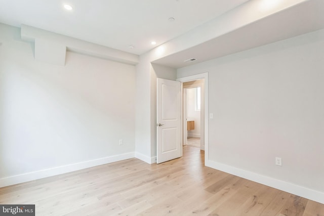 spare room featuring light hardwood / wood-style flooring