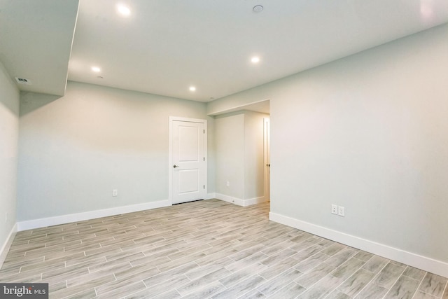 empty room with light hardwood / wood-style floors