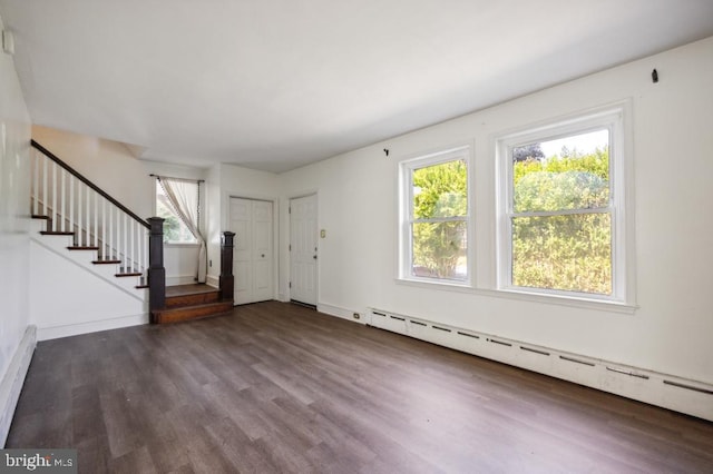 foyer with dark hardwood / wood-style floors and a baseboard radiator