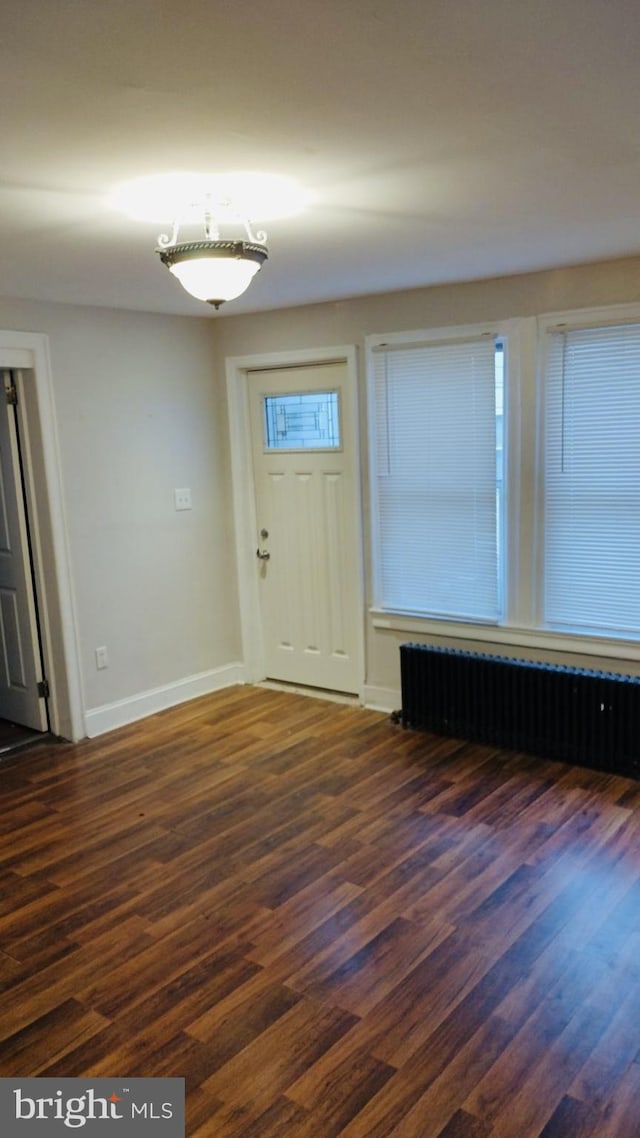 entryway featuring radiator and dark wood-type flooring