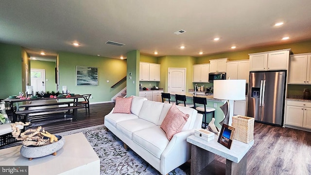 living room with dark wood-type flooring