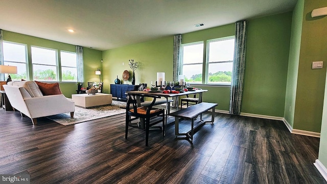 dining space featuring dark hardwood / wood-style flooring