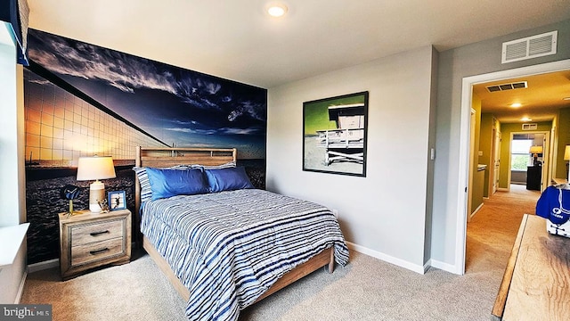 bedroom featuring light carpet