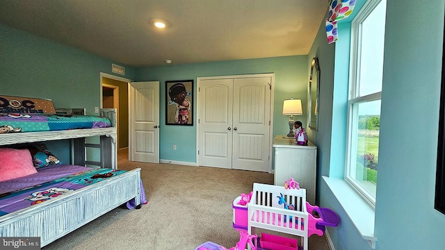 bedroom featuring a closet and carpet floors