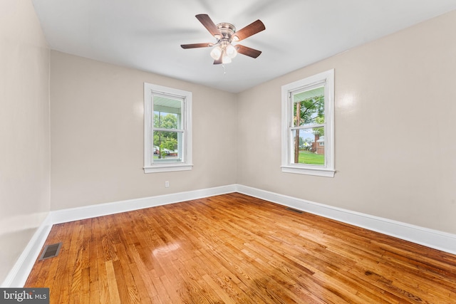 empty room featuring ceiling fan and wood-type flooring