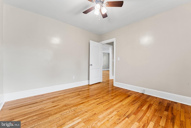 spare room featuring light hardwood / wood-style flooring and ceiling fan