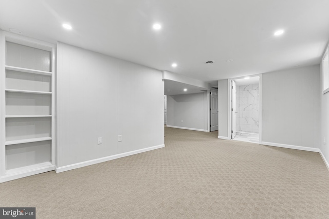 basement with light colored carpet