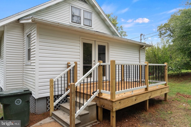 rear view of property with a wooden deck