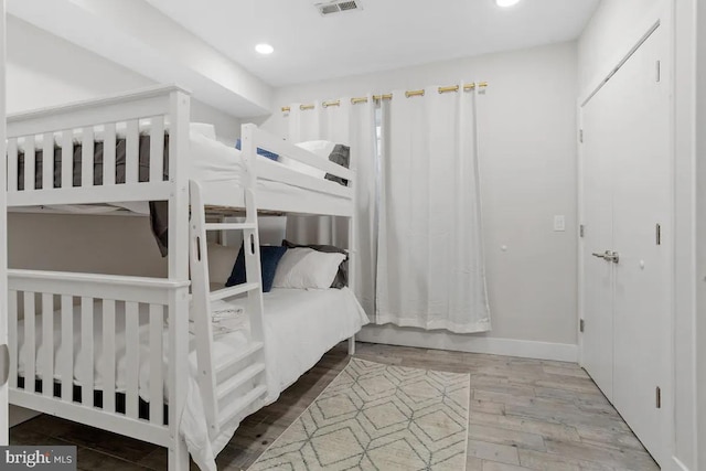 bedroom featuring wood-type flooring