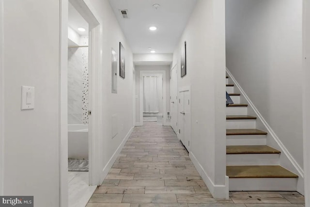 hall with light wood-type flooring