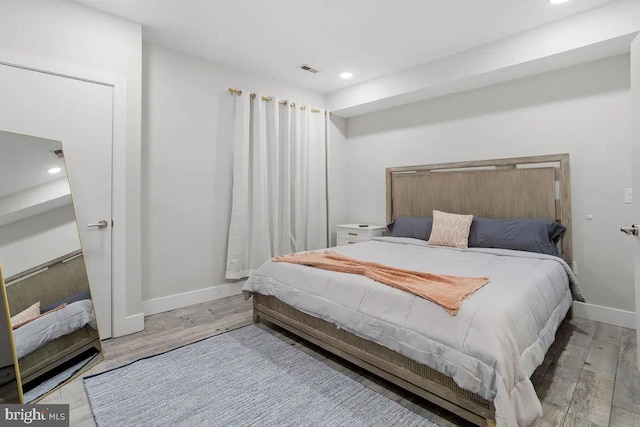 bedroom featuring light hardwood / wood-style floors