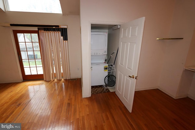 interior space featuring light hardwood / wood-style floors and stacked washing maching and dryer