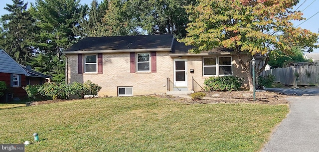 split level home with a front yard