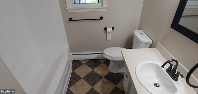 bathroom featuring a baseboard radiator, vanity, and toilet