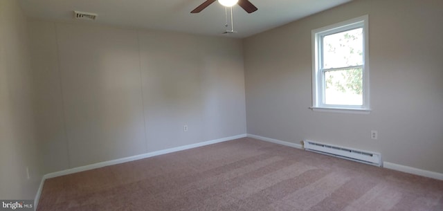 empty room featuring light carpet, baseboard heating, and ceiling fan