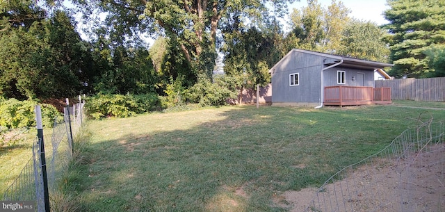 view of yard featuring a wooden deck