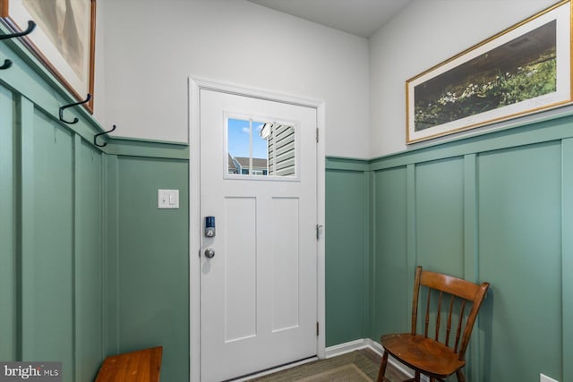 entrance foyer featuring a healthy amount of sunlight and dark hardwood / wood-style floors