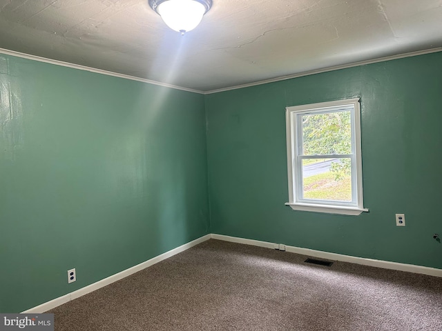 carpeted empty room with crown molding