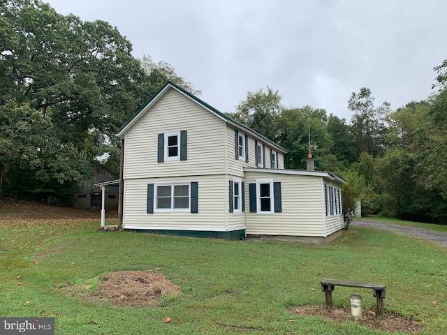 view of home's exterior featuring a yard