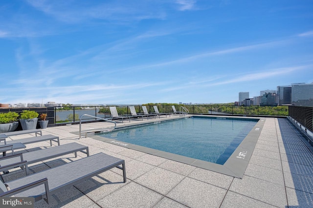 view of swimming pool with a patio